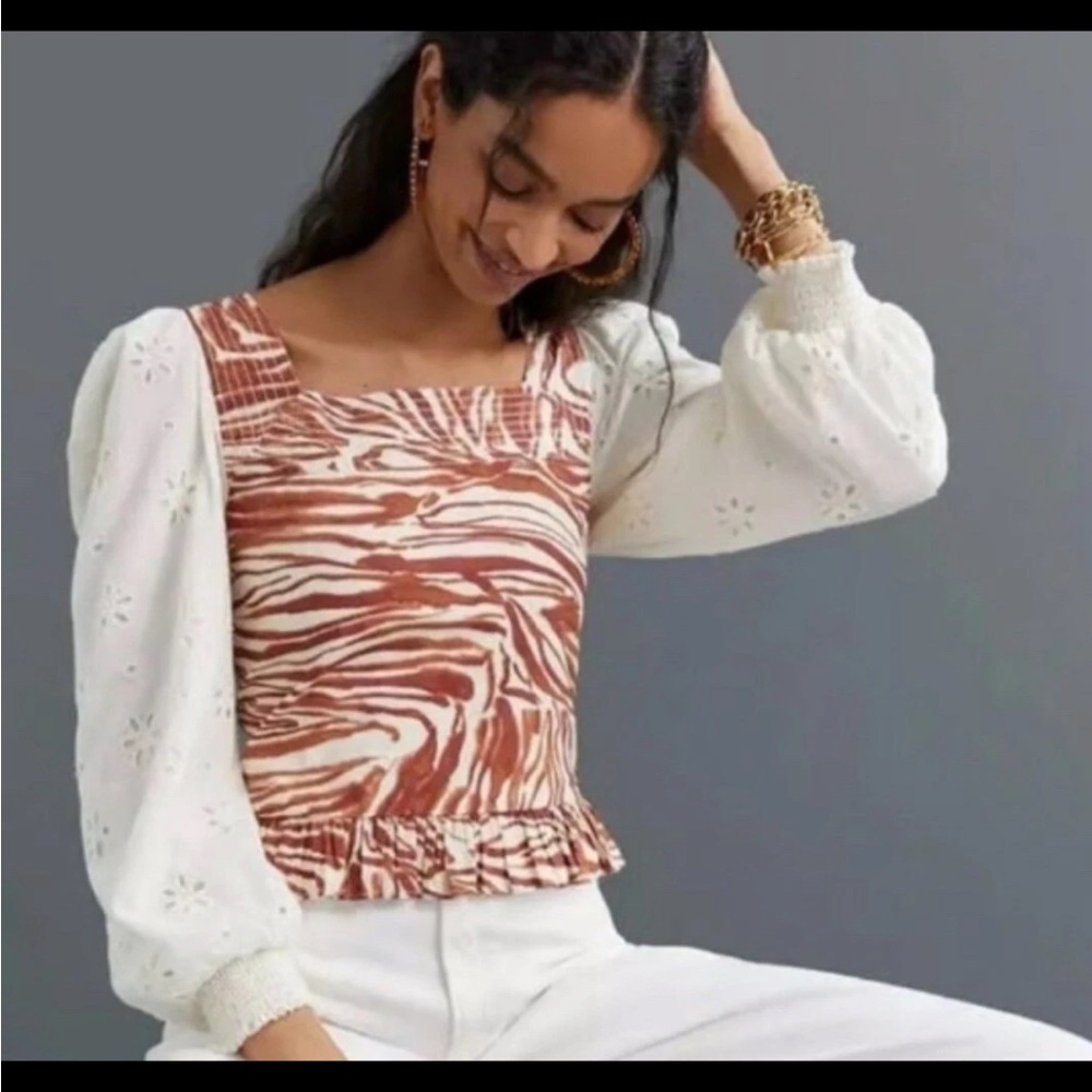 Love the label. Zebra Print Blouse with White puffy sleeves